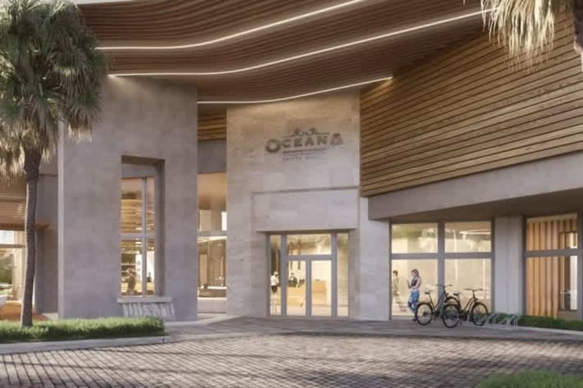 Luxurious contemporary entrance with palm trees and natural wood elements at Oceana Residences