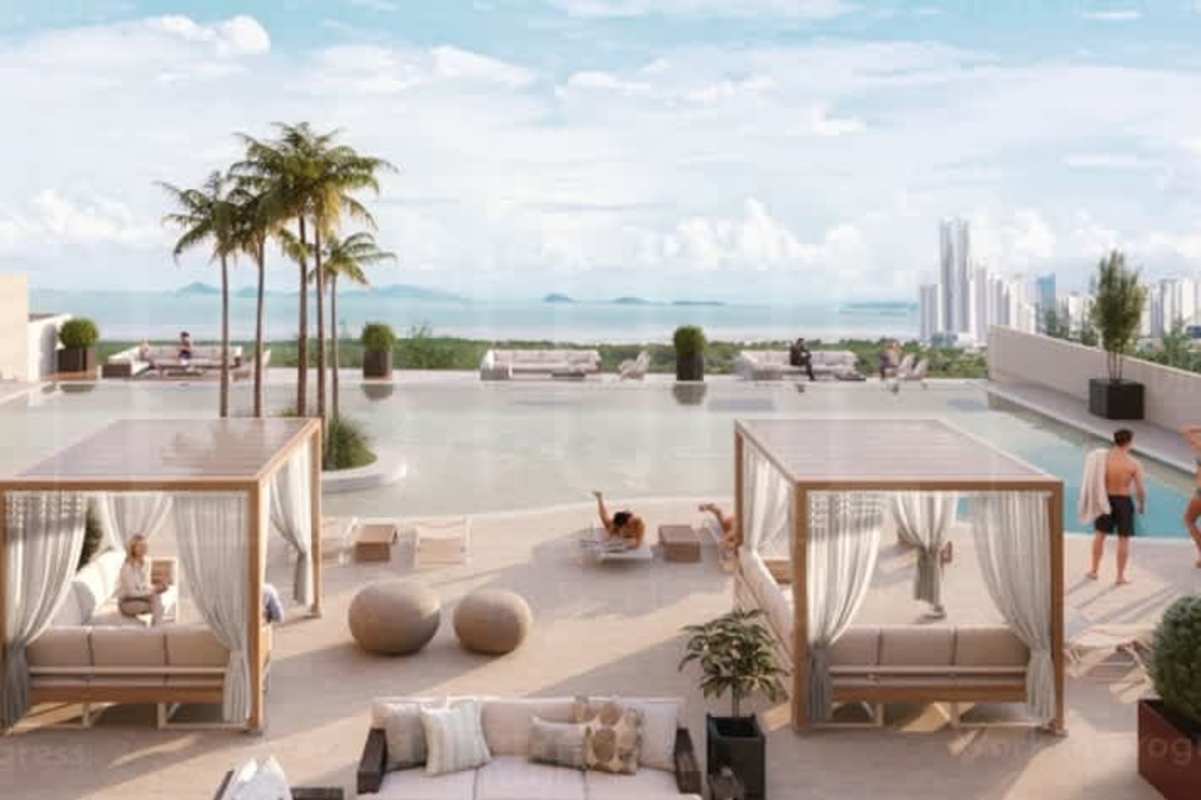 Rooftop pool deck with private cabanas overlooking city skyline at Oceana Residences Santa María