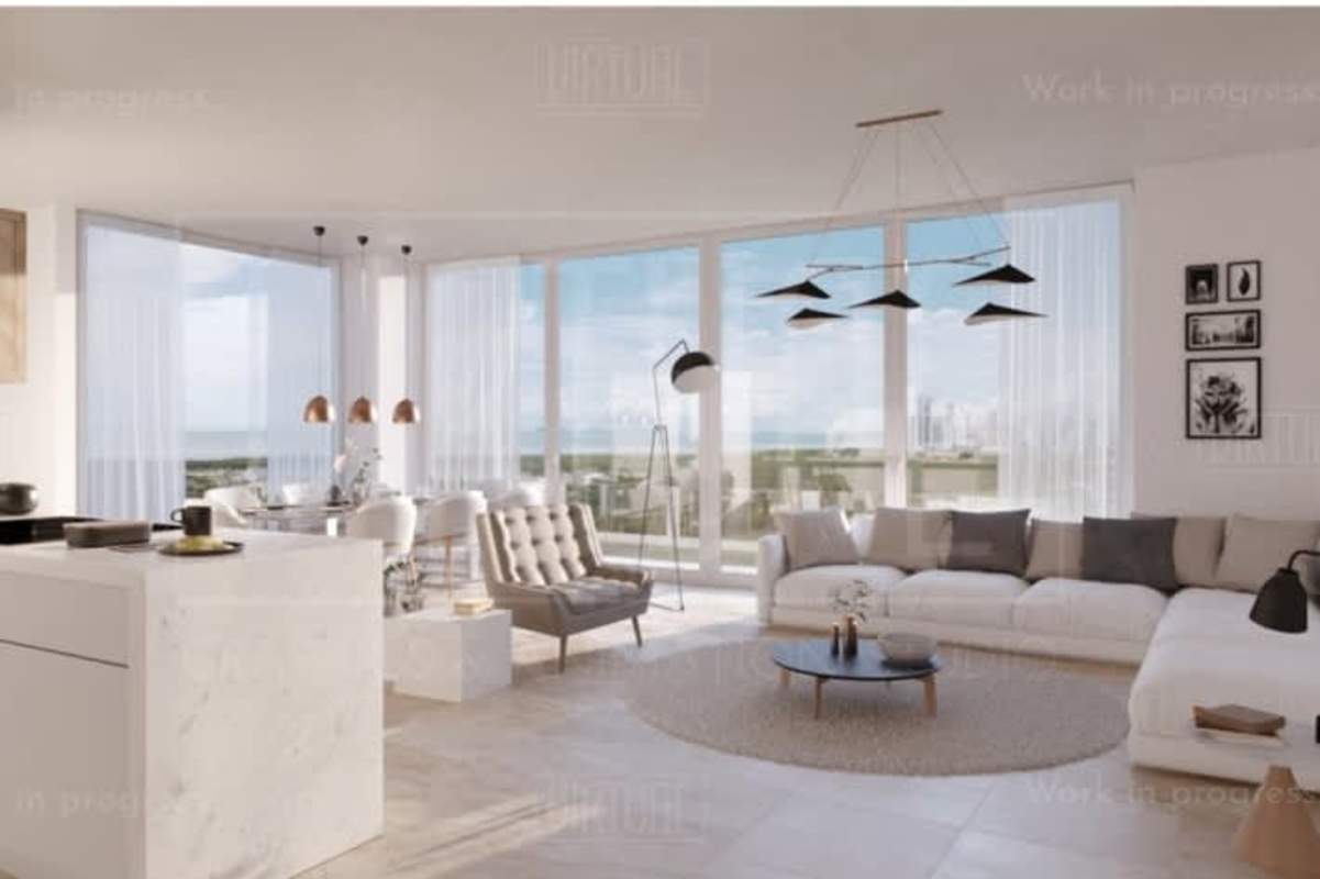 Open-plan living and kitchen space with city view floor-to-ceiling windows in Oceana Santa María Panama