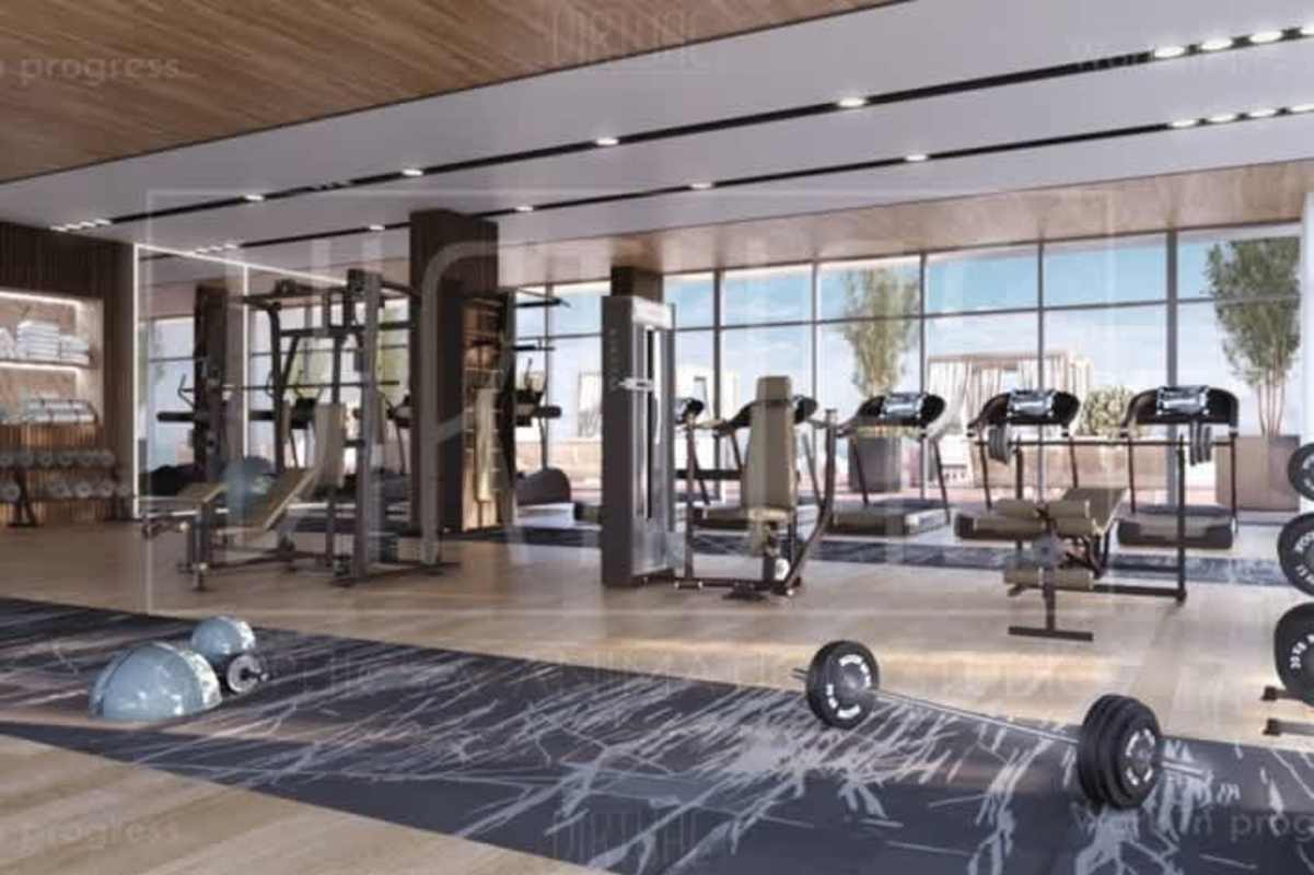 Modern gym with panoramic windows and fitness equipment in Oceana Santa María Panama