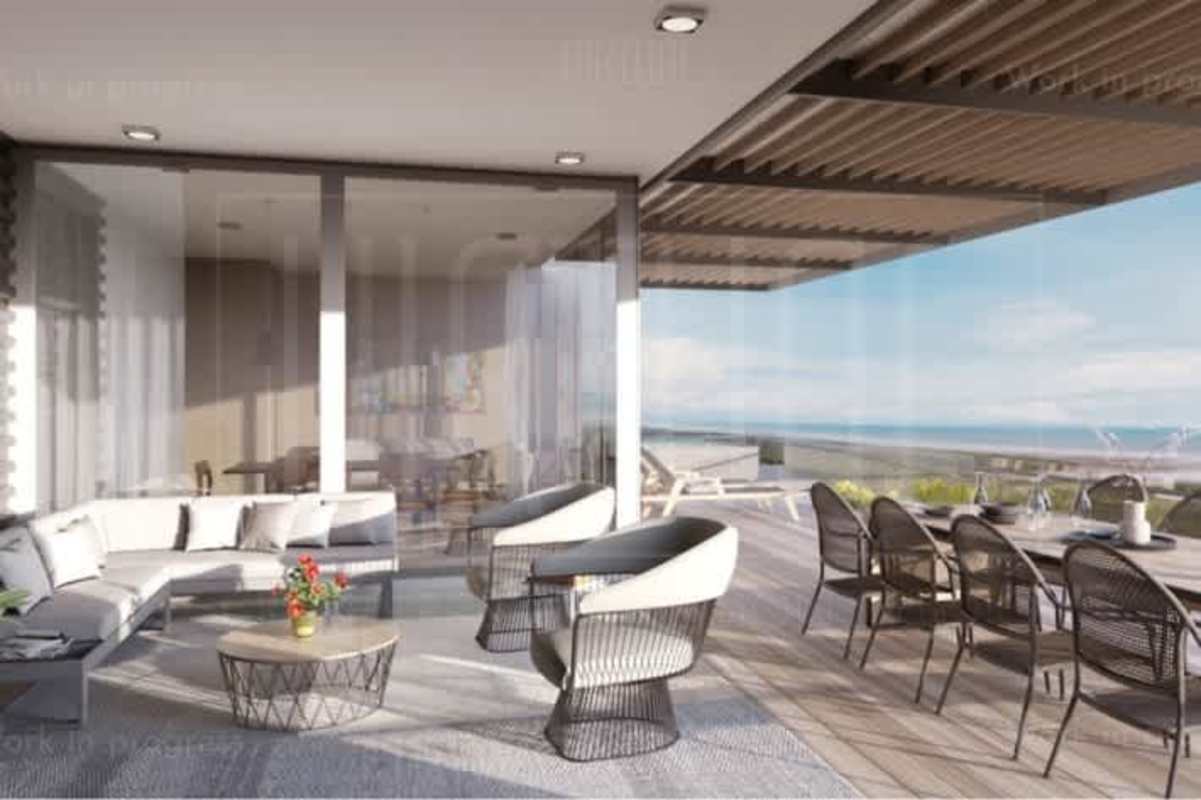 Spacious outdoor terrace with lounge, dining furniture and ocean view at Oceana Panama
