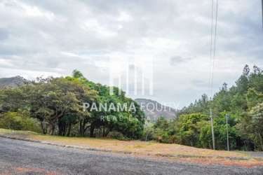 Mountainous landscape with forked paved road and green forest surrounding Granada Altos del María Panama