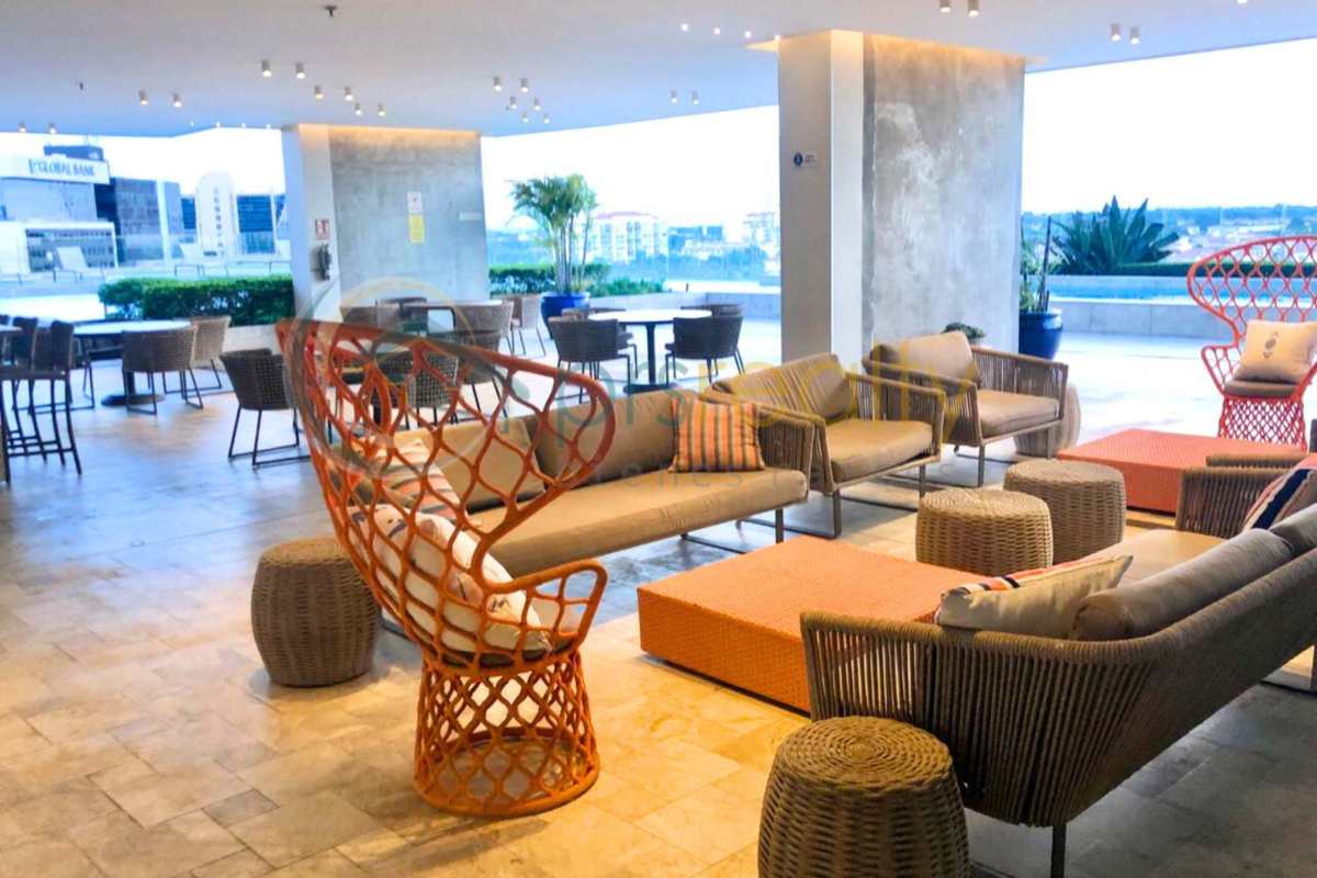 Modern living room opens to balcony with panoramic Santa Maria views in PH Greenview Panama