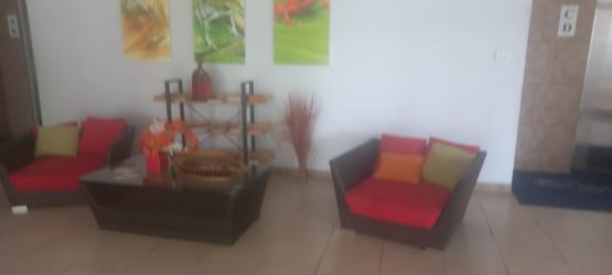 Oceanfront condominium tower with landscaped circular driveway Founders at Playa Blanca Panama