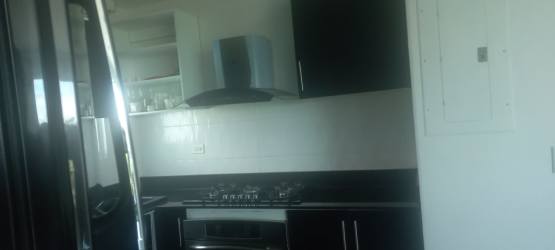 Covered balcony with outdoor seating overlooks Playa Blanca resort Founders Tower Panama