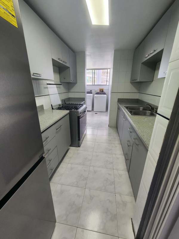 Galley kitchen with granite countertops, overhead cabinets Punta Paitilla Panama