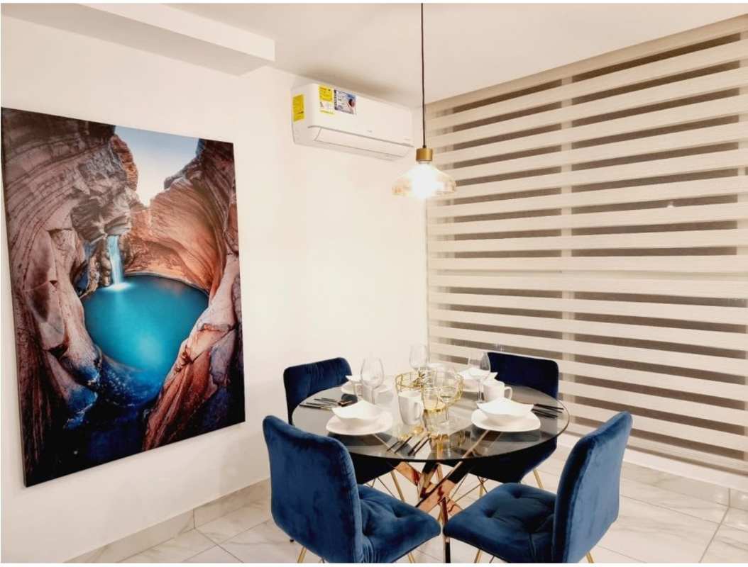 Bedroom with large window featuring Pacific Ocean view, modern furnishings in PH BICSA tower Panama City