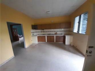 Simple sitting room with teal accent wall plastic chairs for sale Panama Chitré