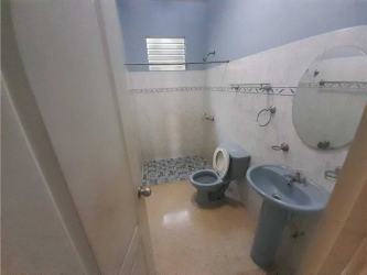 Compact bathroom with vintage blue sink and toilet Chitre house for sale