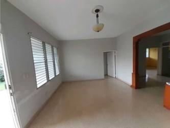 Main bedroom with split AC unit, tile floor, large windows for sale El Vigía Chitré Panama