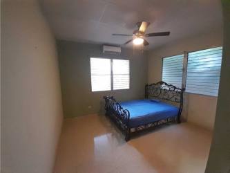 Bedroom with split AC and ceiling fan ceramic floor Chitré Panama house for sale