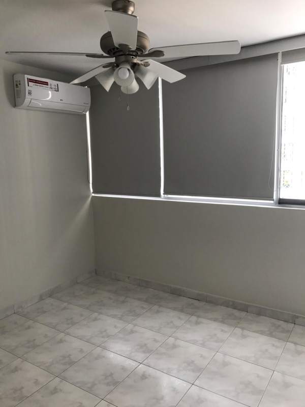 Bedroom with split AC, ceiling fan, tiled floor, view window in PH Punta Paitilla Panama
