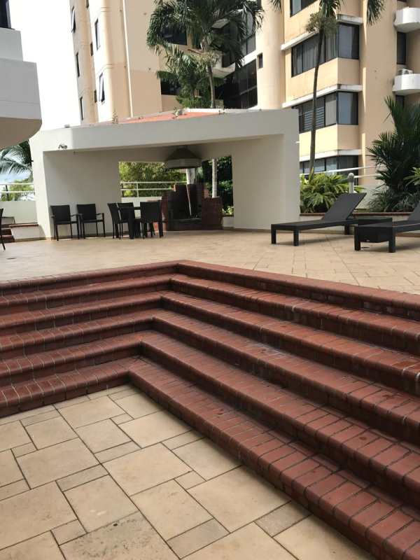 Bright minimalist hallway with closets and ceiling fan in PH Punta Paitilla Panama
