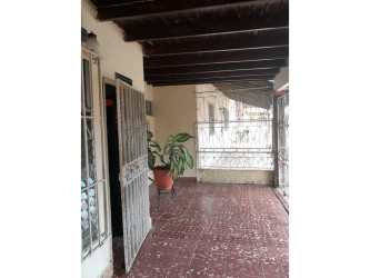 Bathroom with pedestal sink, cabinet and tiled floor in Las Tablas house