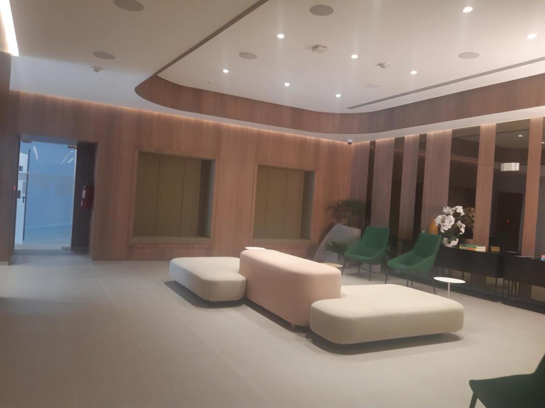 Elegant lobby with wood panel walls seating and decor PH Van Gogh Panama