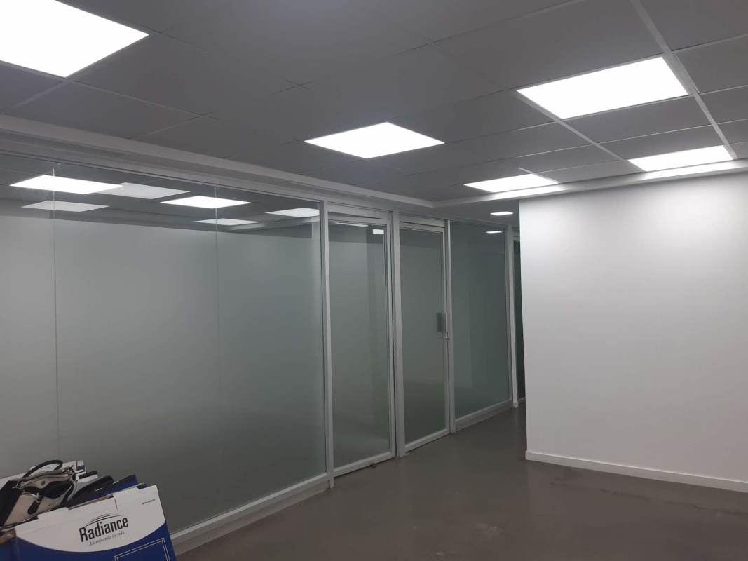 Hallway with glass partitions in commercial space PH Royal Center Panama City