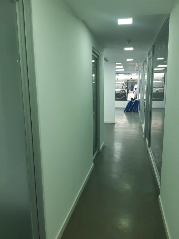 Interior corridor glass partitioned offices PH Royal Center Marbella Panama