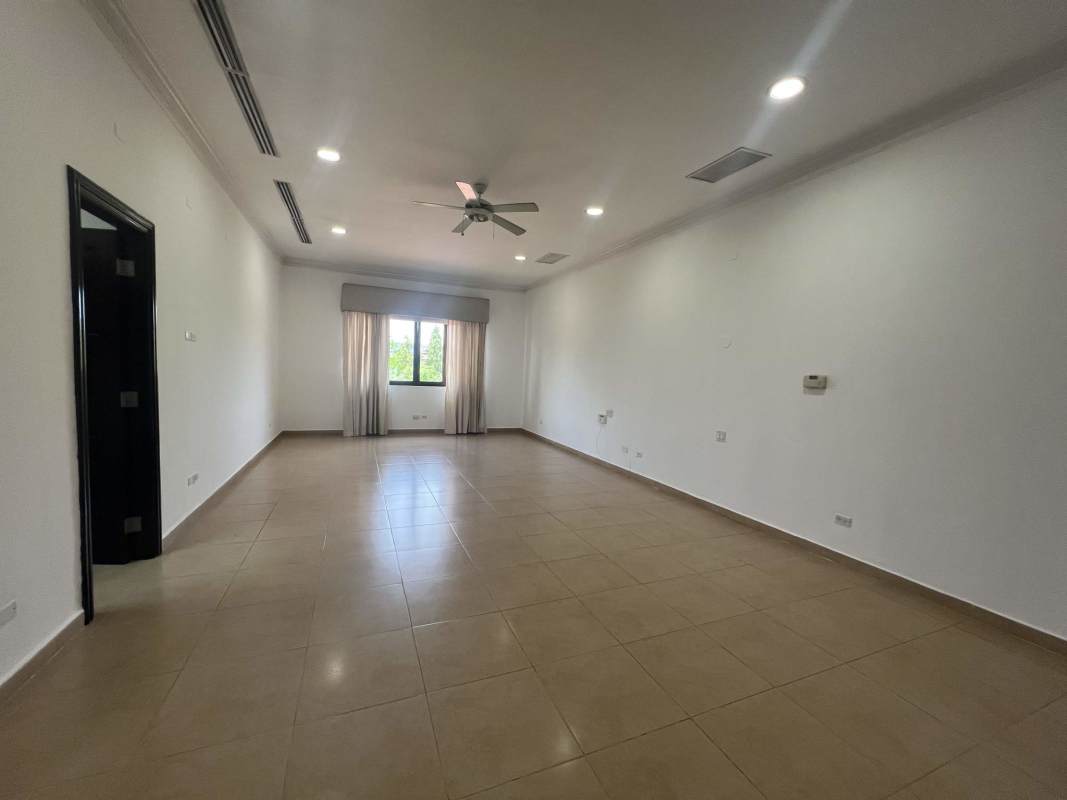 Bright family room with marble floors and windows in Costa del Este property Panama