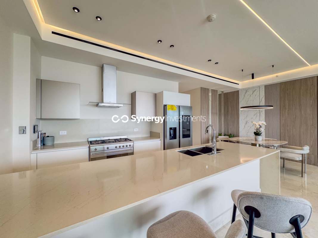 Modern peninsula-style kitchen marble finishes Ocean Reef Islands Panama