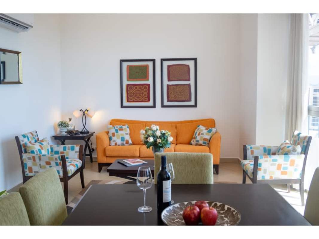 Custom-built closet with dark wood cabinetry in PH Coral Tower penthouse Panama