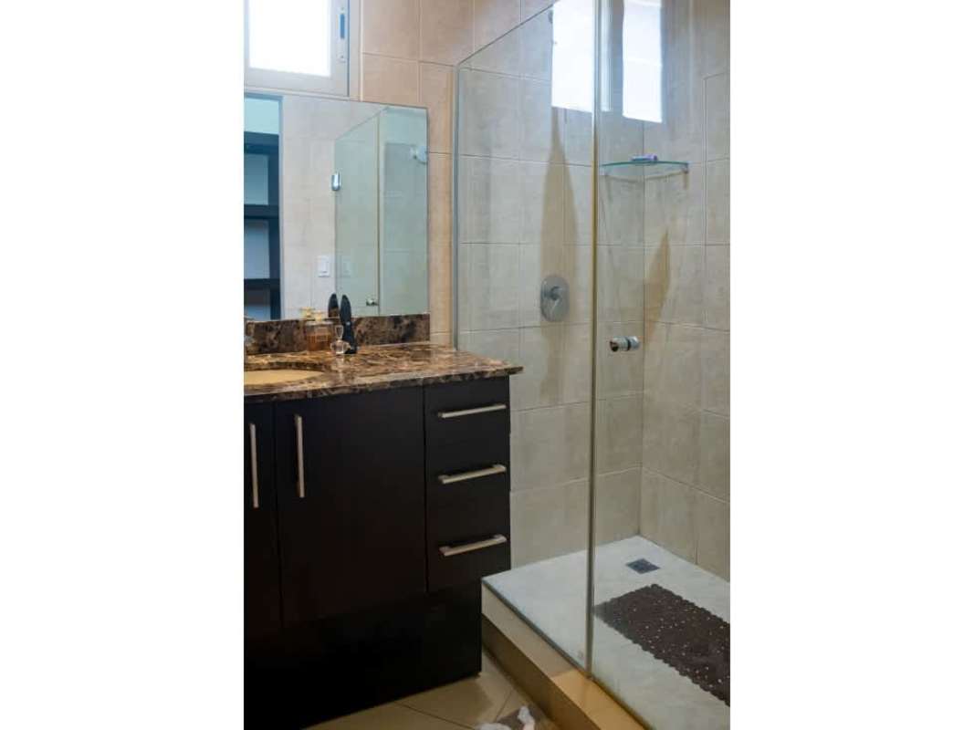 Modern bright living room with balcony access and city views at PH Coral Tower Coco del Mar