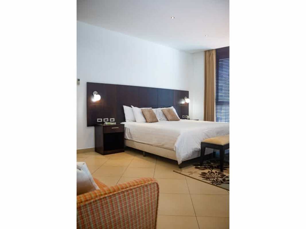 Spacious master bedroom with king bed, large window, AC, closet in PH Coral Tower Coco del Mar