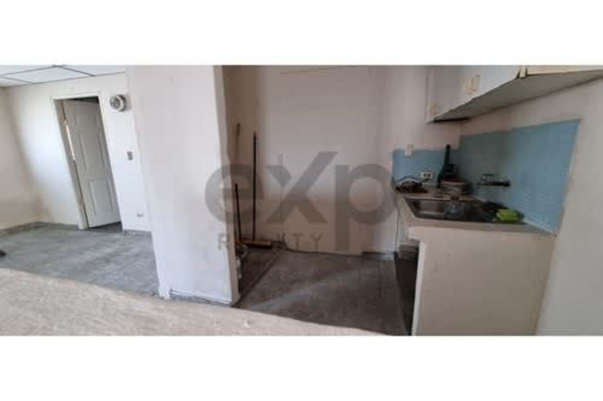 Simple kitchen with blue backsplash tile in Villa Rica house for sale Panama