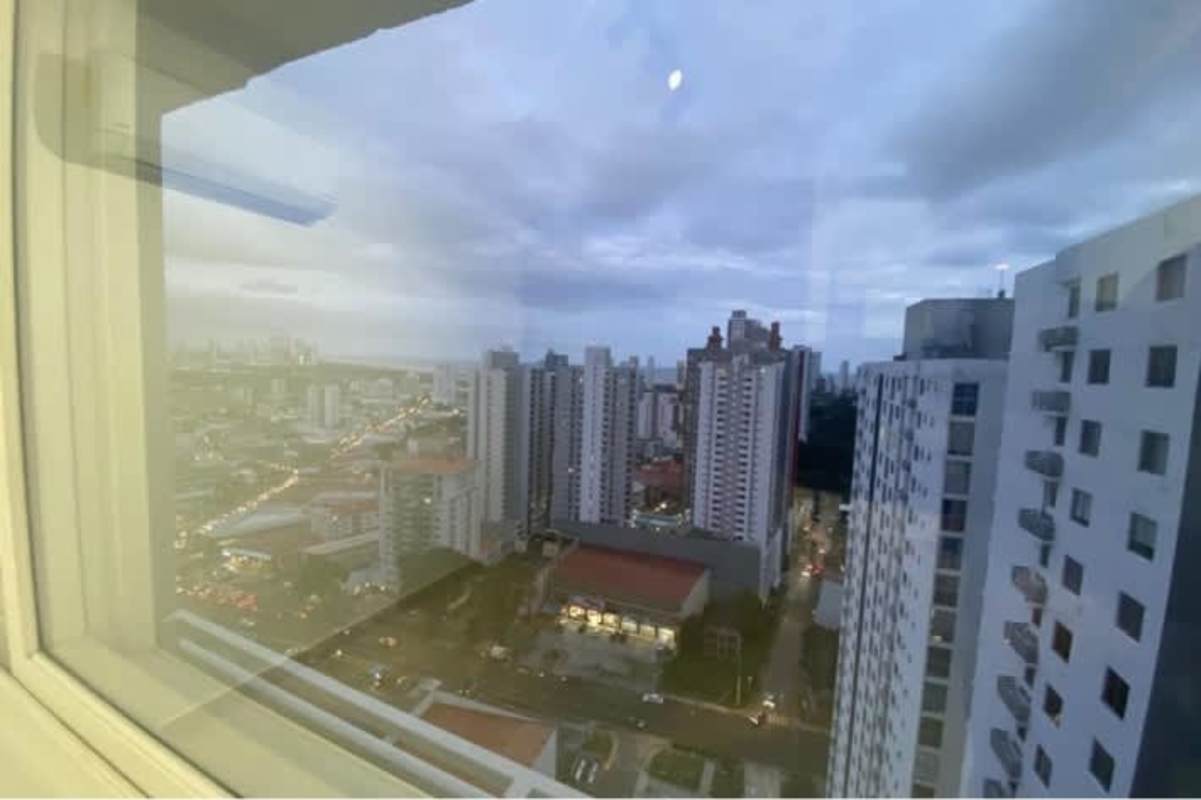 City skyline view from large apartment window at dusk in PH Metropolis Carrasquilla Panama