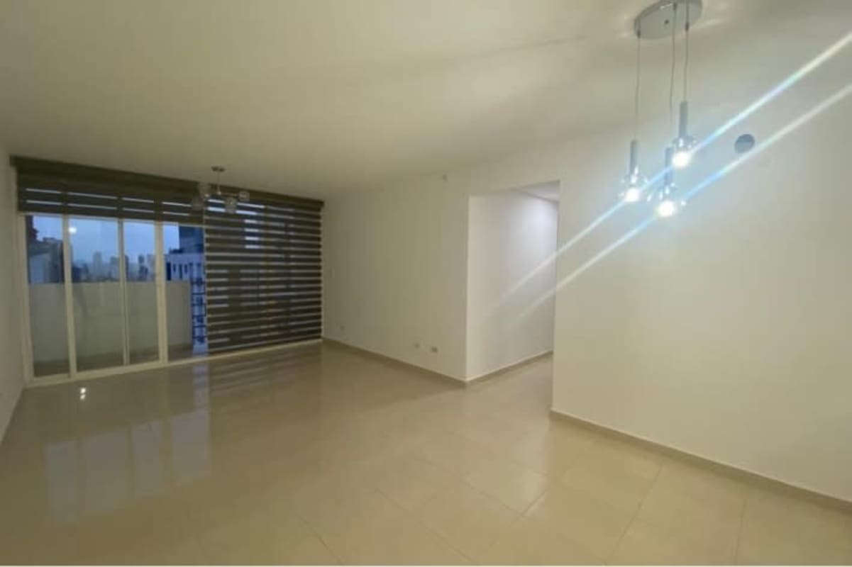 Bright living area with floor-to-ceiling glass doors in PH Metropolis Carrasquilla Panama