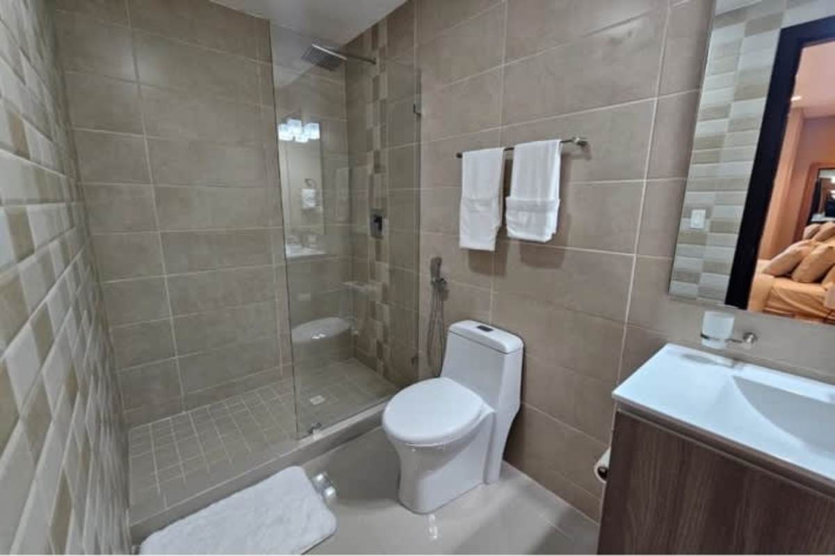 Elegant bathroom with glass-enclosed shower vanity ceramic tiles in Bella Vista 50 Tower Panama