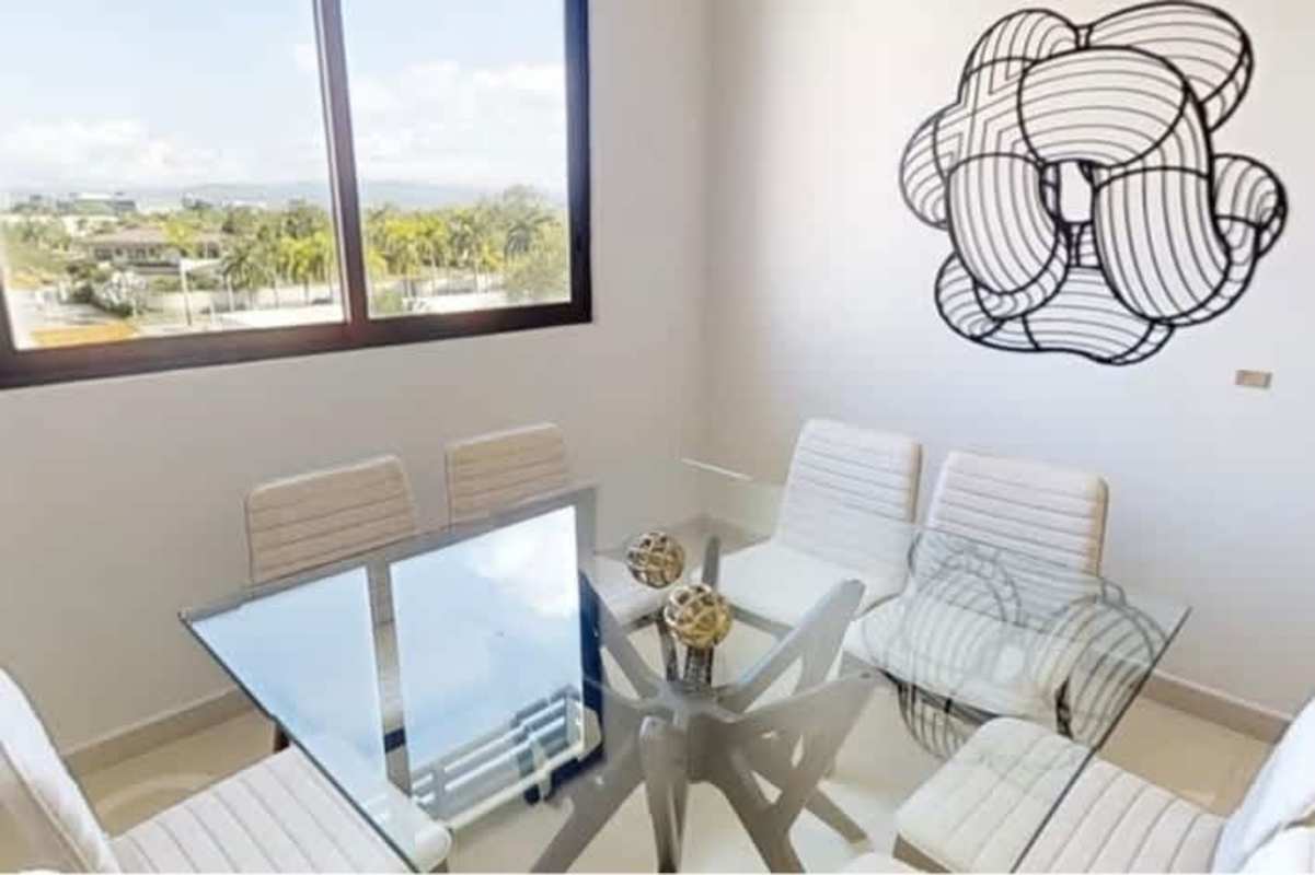 Double height open living-dining area, balcony access in Casa Bianca Costa del Este Panama