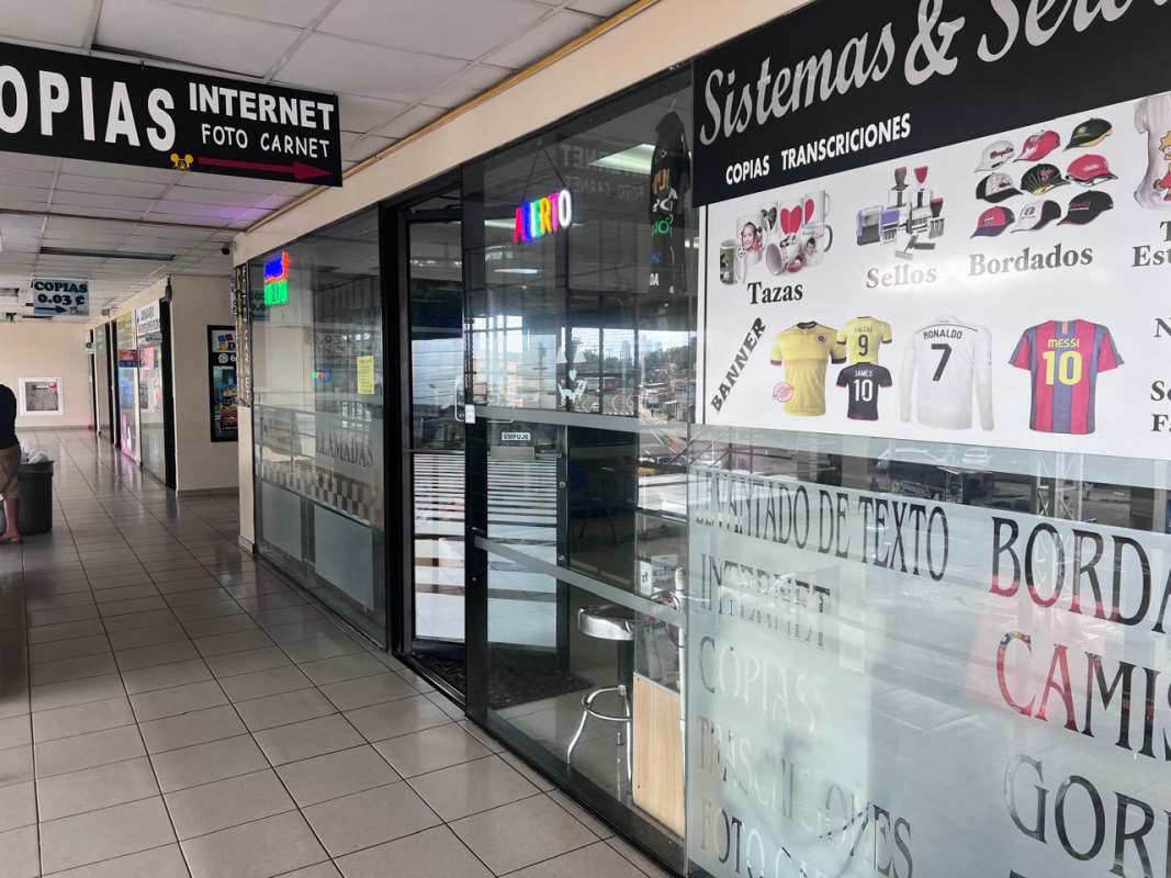 Interior shopping center view with multiple copy print internet shops San Miguelito Panama