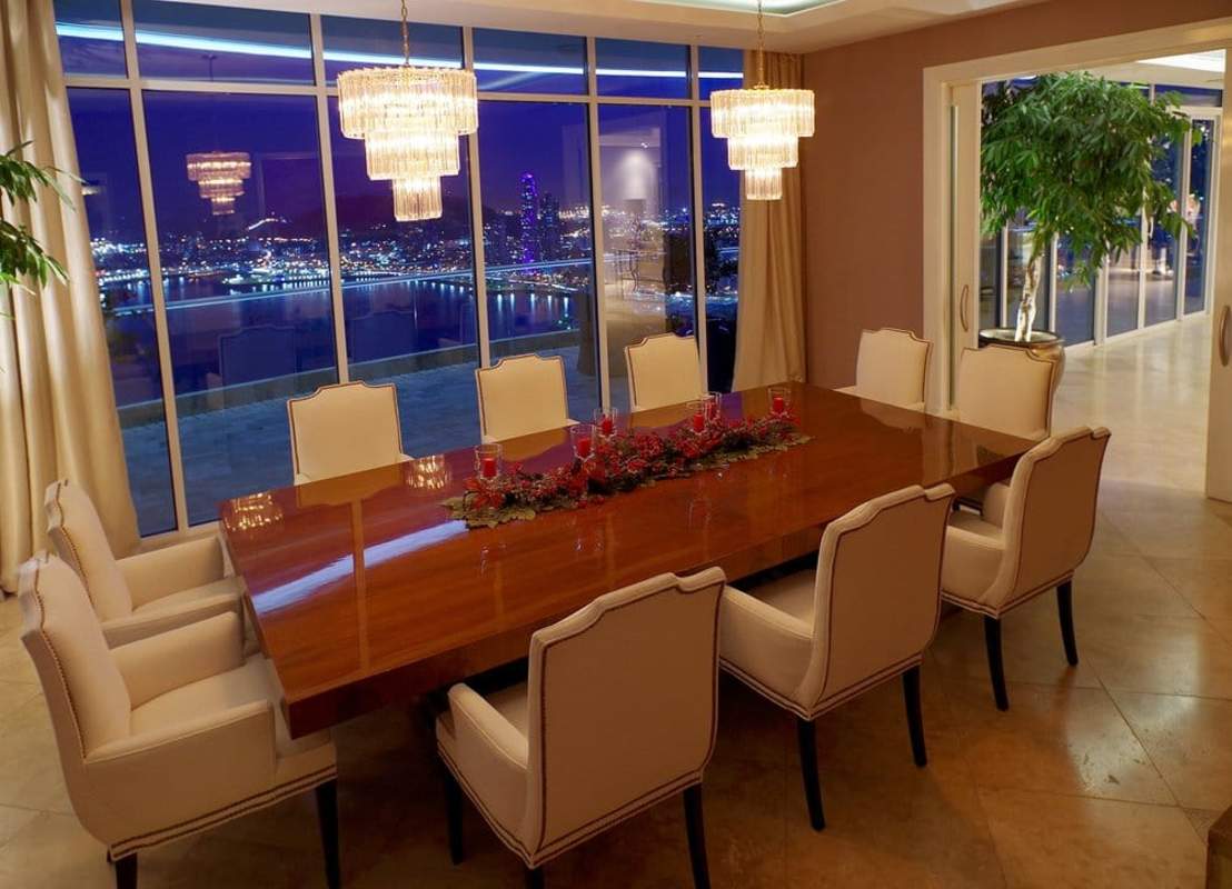 Spacious luxury living room with piano, floor-to-ceiling windows, Punta Paitilla PH The Point Panama