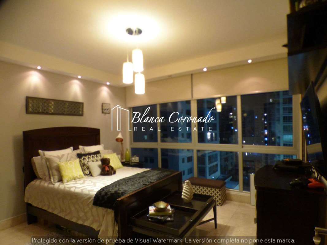 Bright master bedroom with oceanfront views, large windows, PH Ocean Sky Coco del Mar