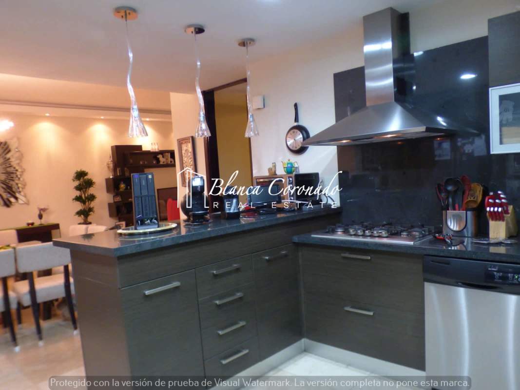 Modern bathroom with marble tiles and granite countertops in PH Ocean Sky in Coco del Mar