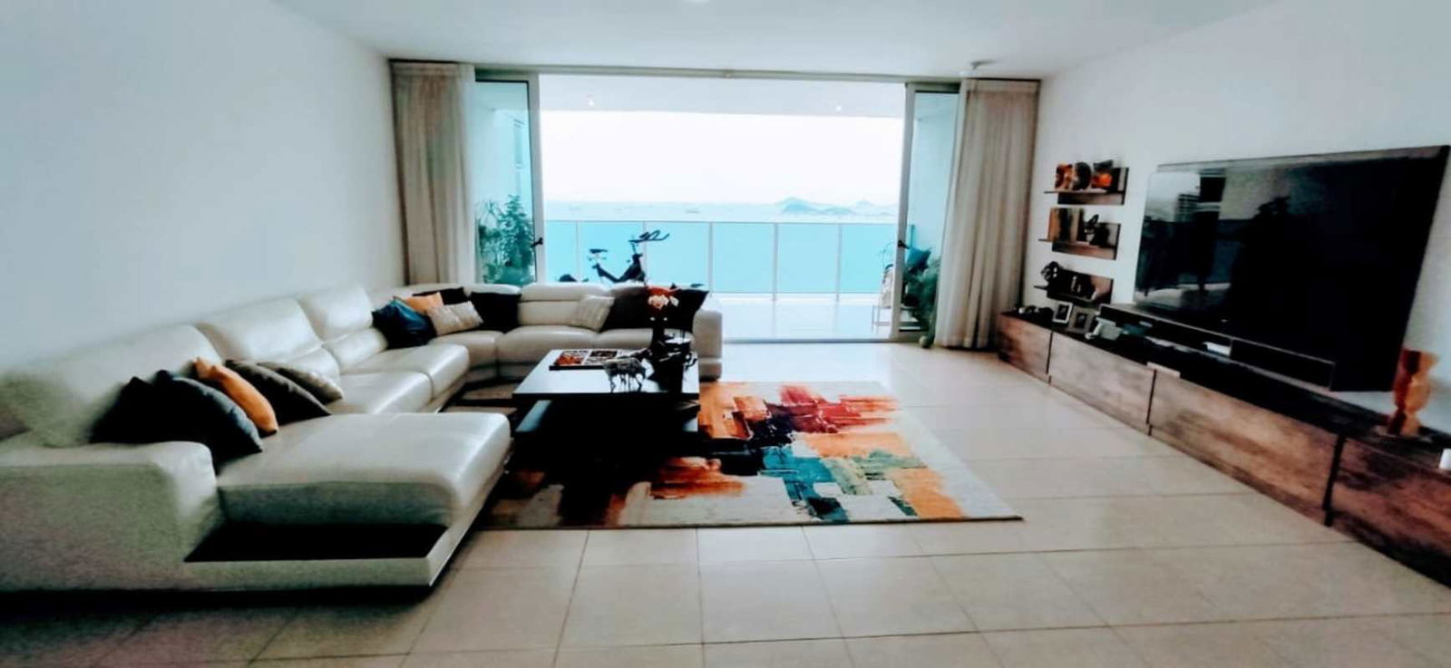 Spacious living room with balcony and stunning ocean views at PH BICSA Tower Panama City