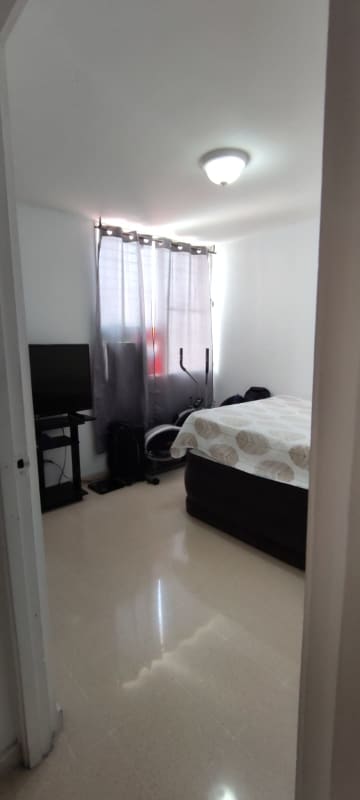Bedroom with natural light, tile flooring in apartment PH Limajo Altos de Santa María Panama City