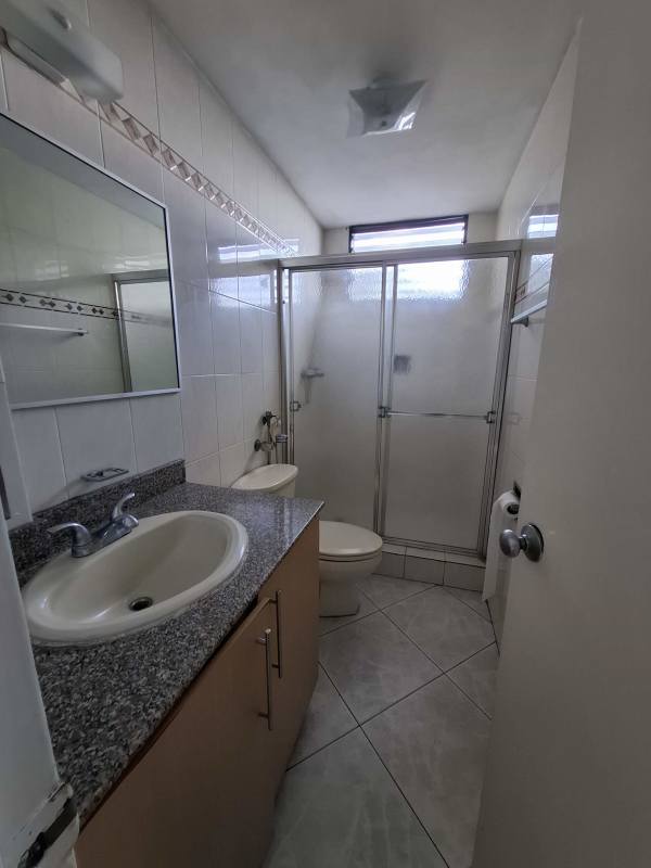 Contemporary bathroom with granite counter and glass shower in Bella Vista Panama
