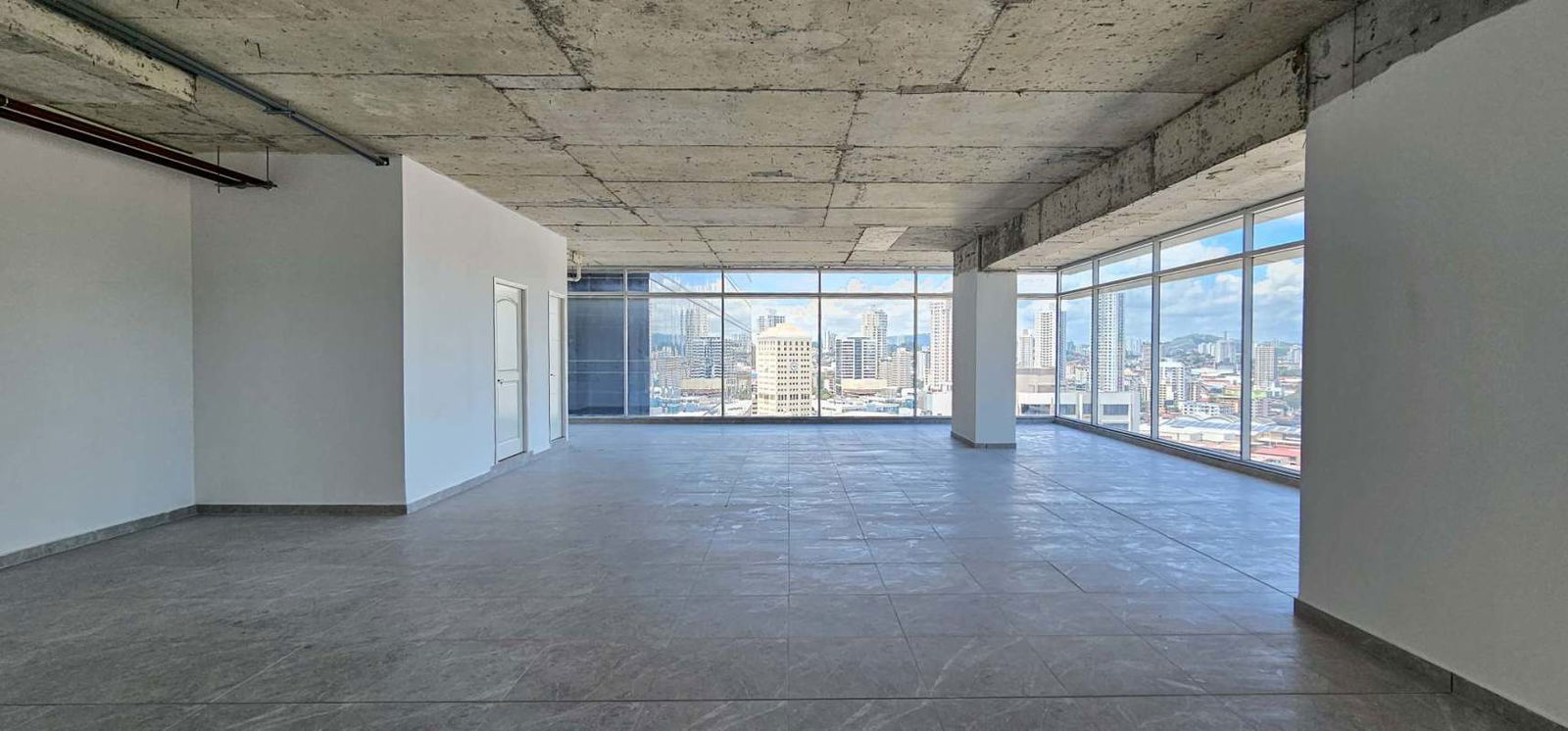 Spacious modern unfinished open-plan office with panoramic windows at Sortis Business Tower in Obarrio Panama