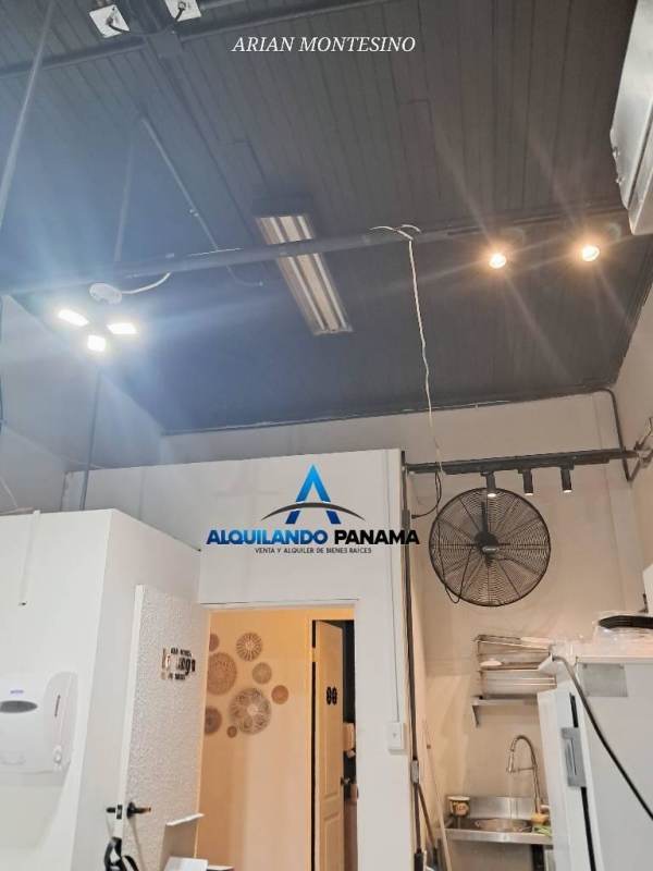 Outdoor patio with tables, plants, city skyline backdrop restaurant for sale Panama City