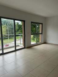 Spacious living room with large glass doors leading to balcony PH Soleo Panama