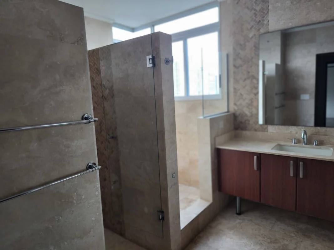 Open space living and dining room with city views and marble floors at PH The View Panama City