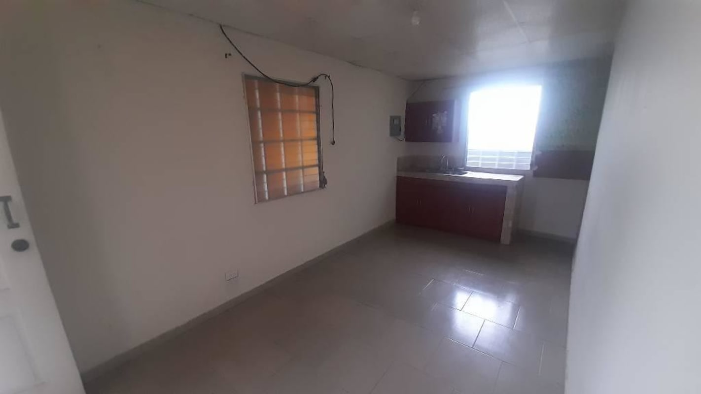 Simple unfurnished small kitchen with window tiled floor Ciudad Radial Panama affordable rent