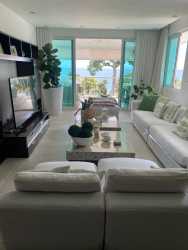 Bright living and dining area with floor-to-ceiling windows and ocean views PH Balboa 2 Panama