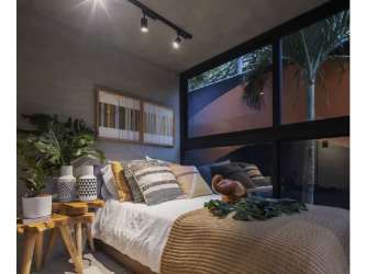 Bedroom with tall windows and natural light in PH MidTower Coco del Mar Panama