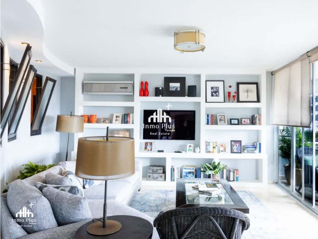 Elegant living room with marble flooring, ocean view, and large windows in PH Elite Bella Vista Panama City