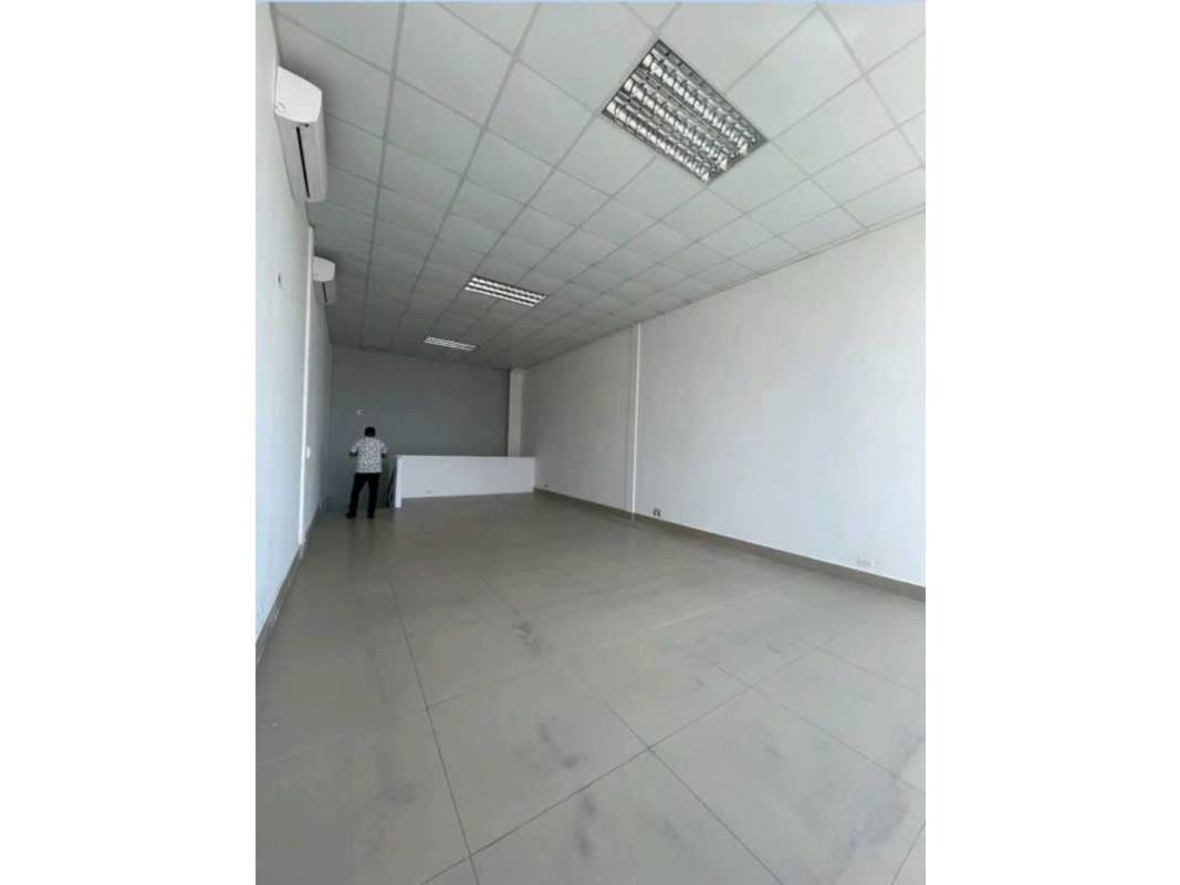 Clean empty commercial retail or office interior with tile floor, AC units, and lighting Plaza 76 San Francisco Panama