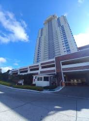 Bright modern living area with large windows overlooking golf course in Coronado Golf Panama