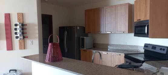 Living room with panoramic golf course views in Coronado Golf Condominium Panama