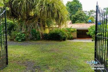 Spacious covered outdoor terrace with ceiling fans overlooking lush tropical garden Chapala Panama